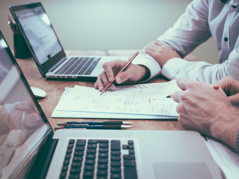 Professionals collaborating at a desk